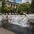 Kids playing in the disappearing fountain on Liberty Square in Budapest Hungary