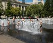 Kids playing in the disappearing fountain on Liberty Square in Budapest Hungary