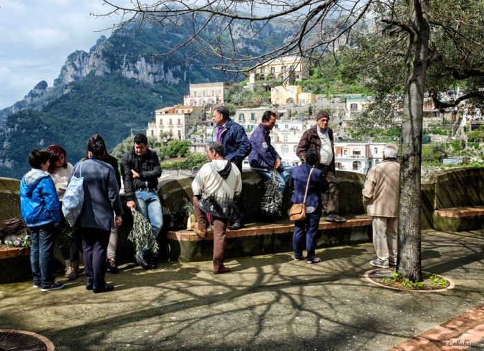 Men waiting outside Palm sunday service in Montpertuso Italyt ia