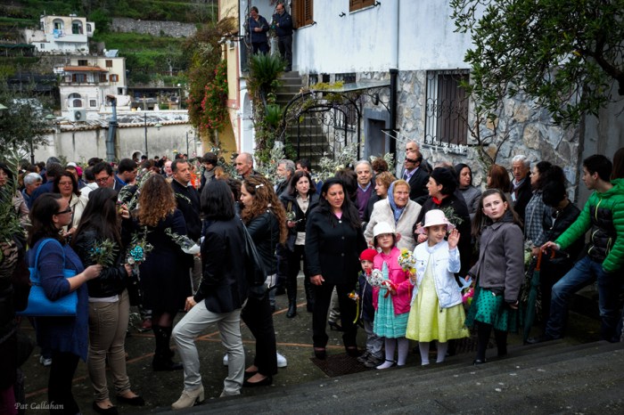 Children gather outside the church on Palm Sunday in Montepertuso Italy