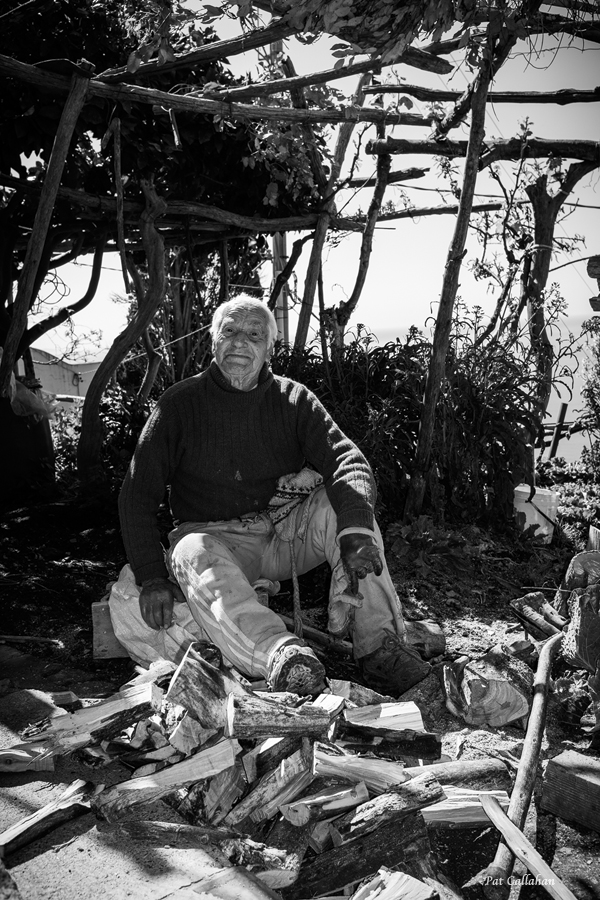 92 year old man in Nocelle Italy chopping wood