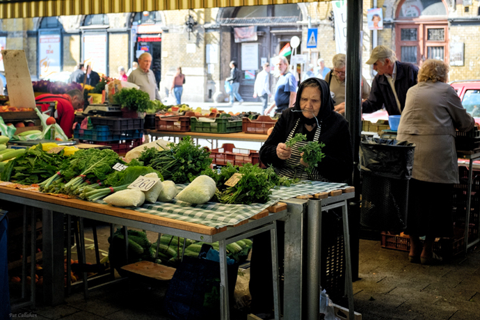 hunyadi ter market woman tying parsley