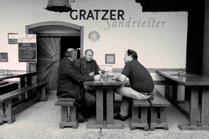 Men drink in front of the cellar we selected