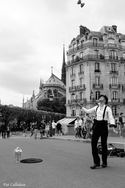 Paris Juggler on Bridge behind Notre Dame